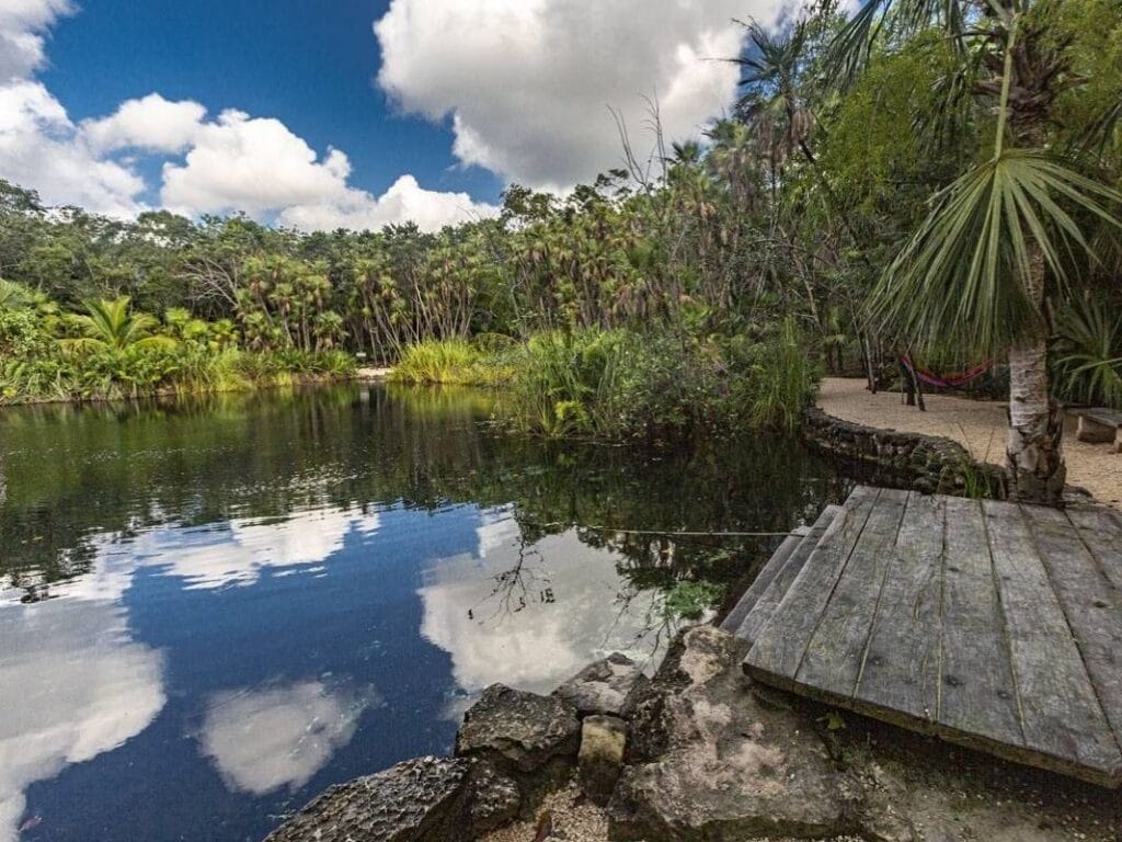 Clouds reflection on cenote crystal
