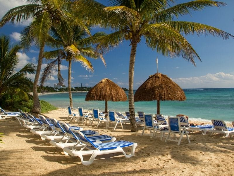 Beach with sun shades and beach chairs