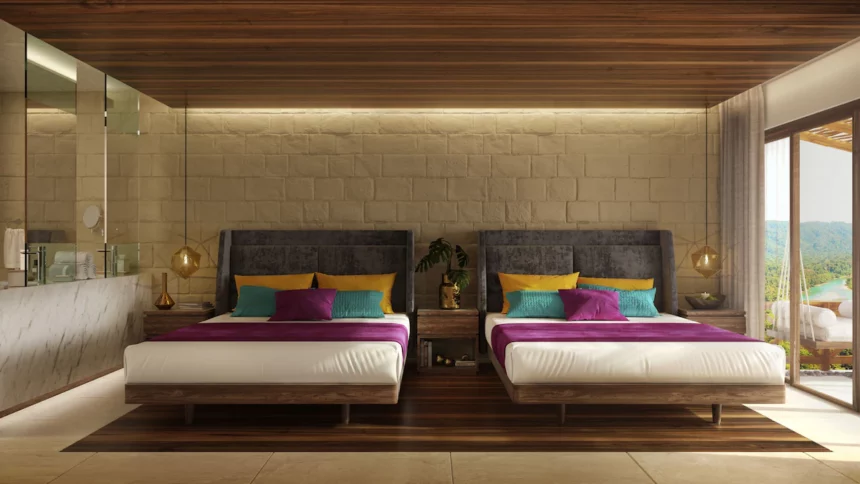 two beds in a hotel room at hotel belo Isla Mujeres