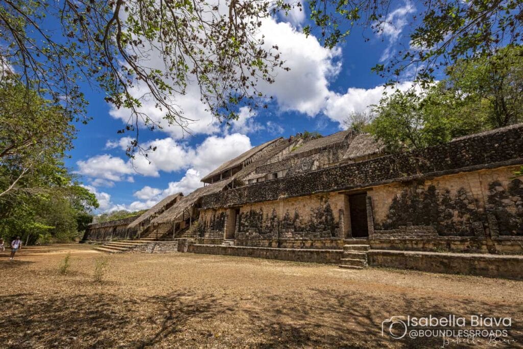 Ancient Mayan ruins under a blue sky.