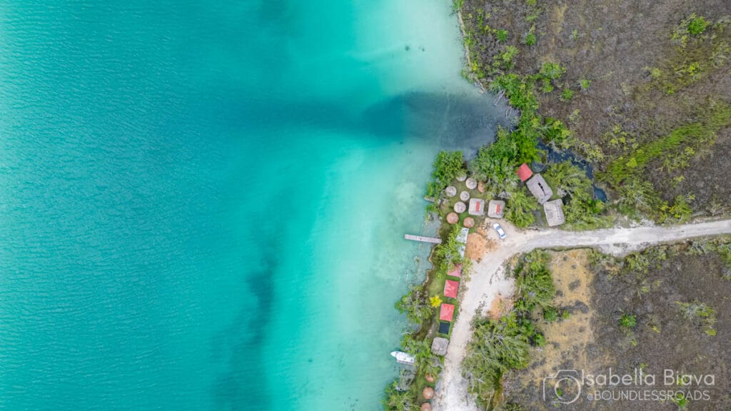 Aerial view of turquoise lagoon and shoreline.