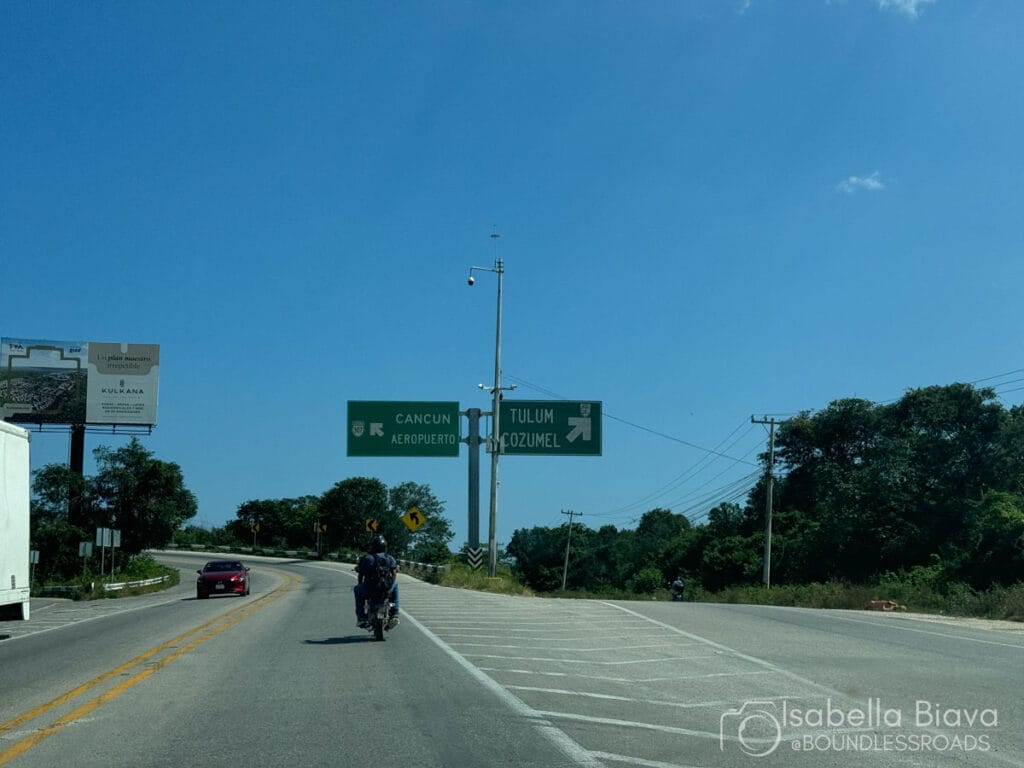 Road sign directions to Cancun and Tulum